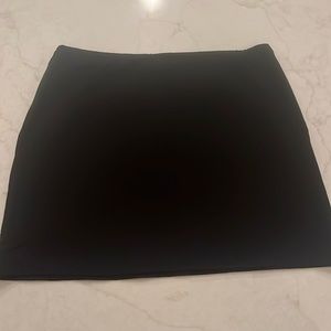 Black stretchy soft jersey mini skirt. Never worn.